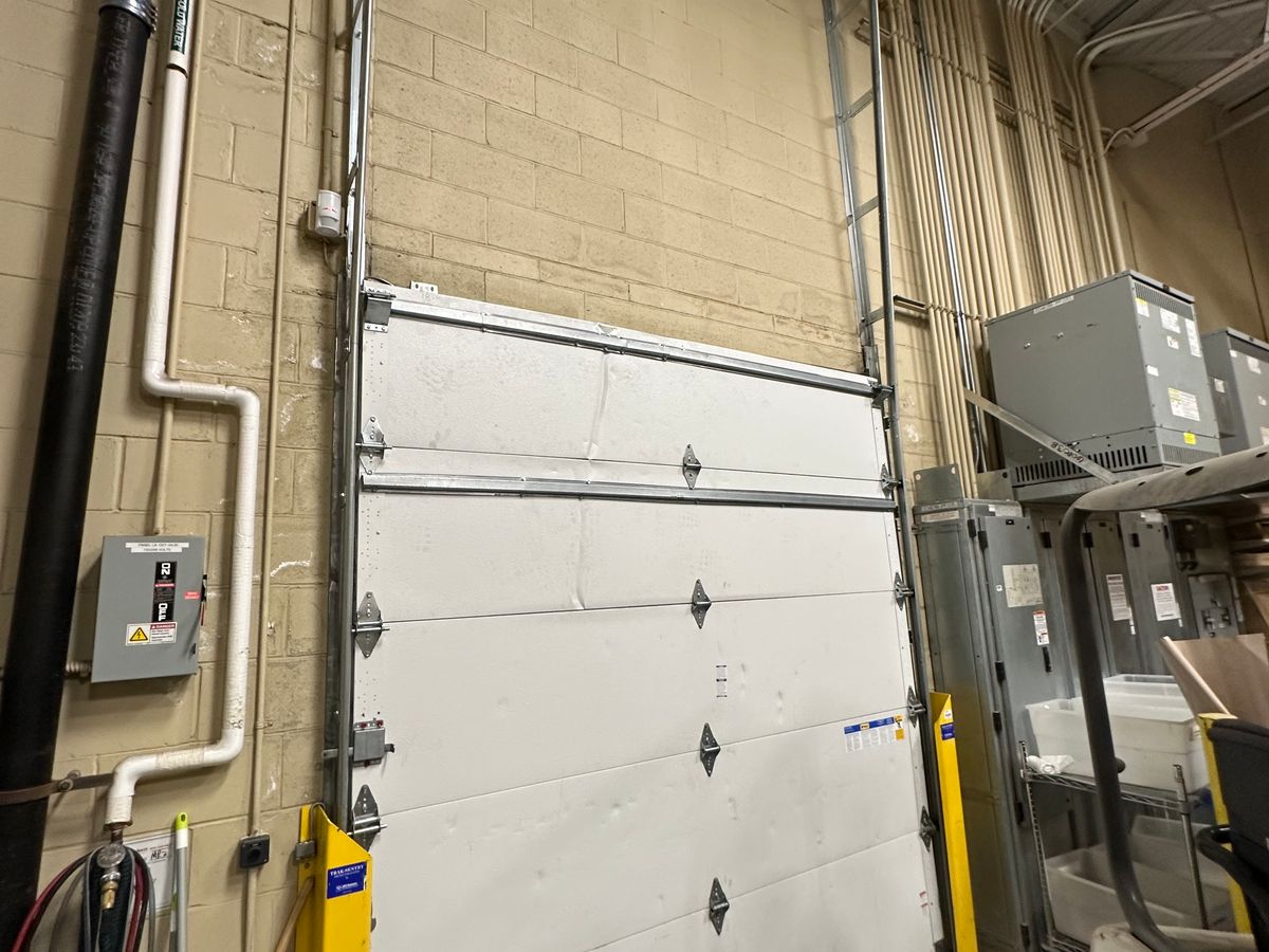 Industrial commercial garage door with mechanical opener system in Massachusetts